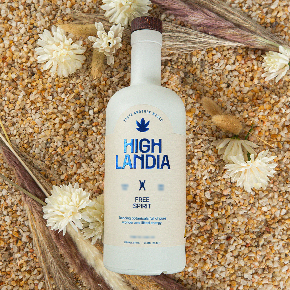 Highlandia Free Spirit THC drink mixer bottle on a grain bed with dried flowers